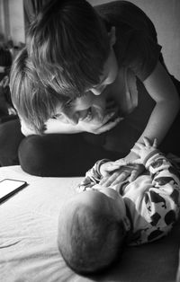 High angle view of boy playing with toy at home