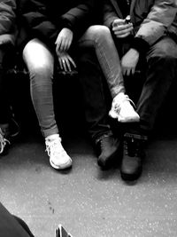 Low section of men sitting on floor