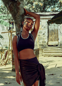 Portrait of young woman standing outdoors