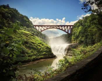 Scenic view of bridge over river against sky