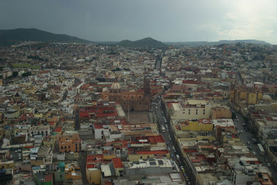 Aerial view of town against sky