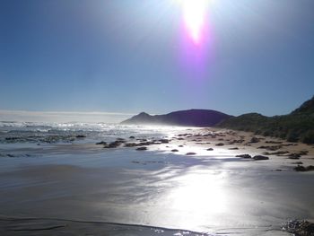 Sun shining over sea