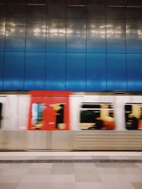 Blurred motion of train at railroad station