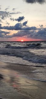 Scenic view of beach against sky during sunset