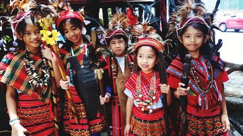 Smiling friends in traditional clothing