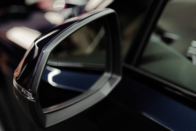 Close-up of side-view mirror of car