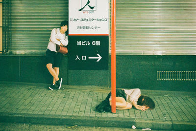 Rear view of people at subway station