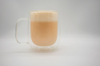 Close-up of coffee cup against white background