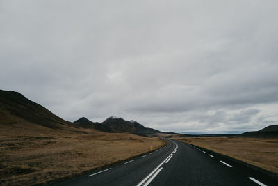 View on the road leading towards mountains in iceland