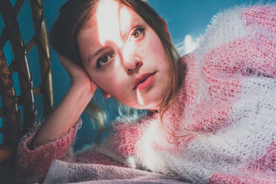 Portrait of smiling young woman lying down