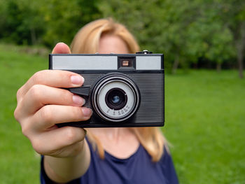 Portrait of woman photographing