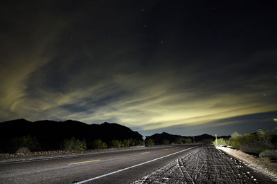 Empty road against sky