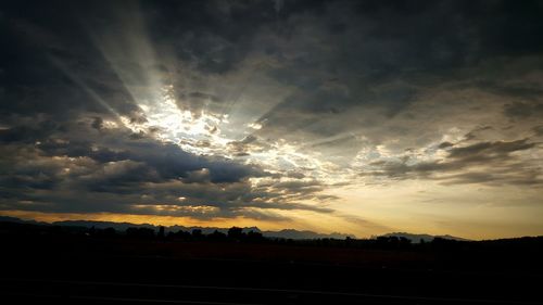 Scenic view of landscape against sky at sunset