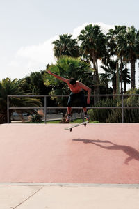 Skateboarder doing a trick in a skate park