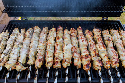 High angle view of meat on barbecue grill