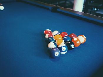 Close-up of pool balls arranged on table