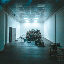 Stack of books in illuminated room