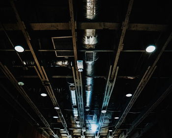 Low angle view of illuminated lights at night