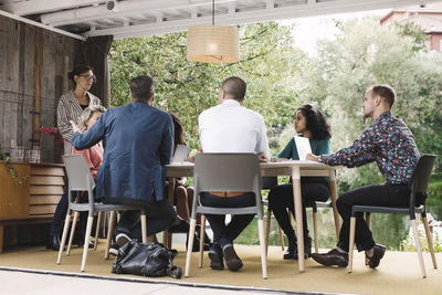 Business people discussing strategy in portable office truck