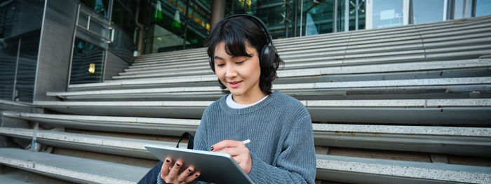 Young woman using mobile phone