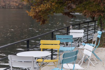 Empty chairs and tables in yard