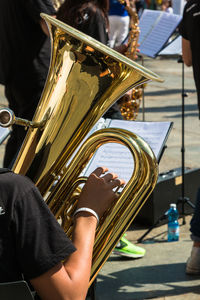 Cropped hand of person playing musical instrument