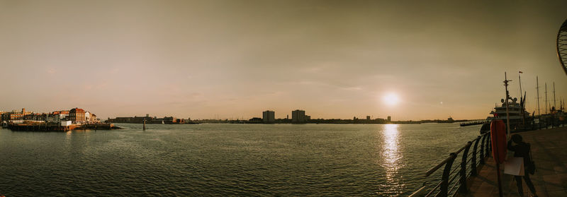 Panoramic view of buildings against sky during sunset