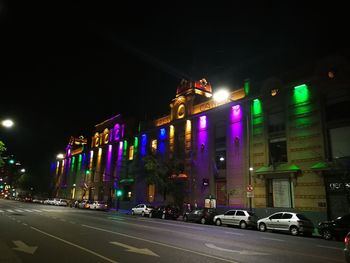 Illuminated city street at night