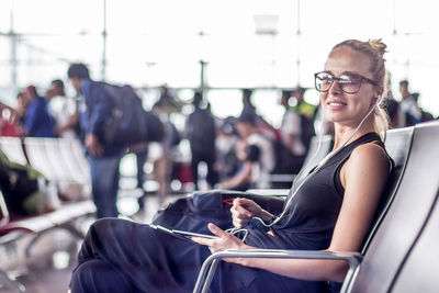 Side view of woman using mobile phone