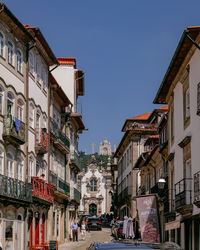 Street amidst buildings in city against sky