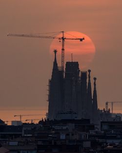 Sun rising behind sagrada familia temple in barcelona