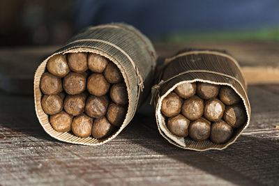 Close-up of cigars on table