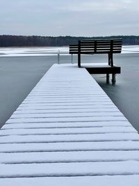 Surface level view of swimming pool against sky during winter