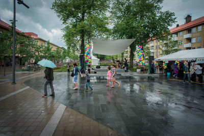 People on wet street in rain