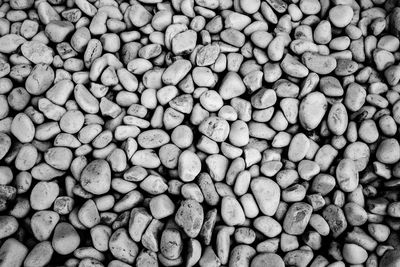 White and black round pebble stones as monochromatic background
