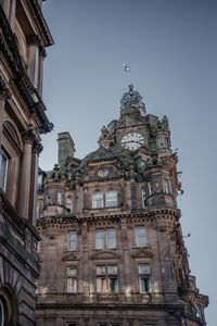Close-up of balmoral hotel clock tower in edinburgh
