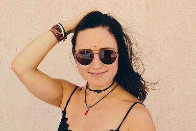 Portrait of young woman wearing sunglasses