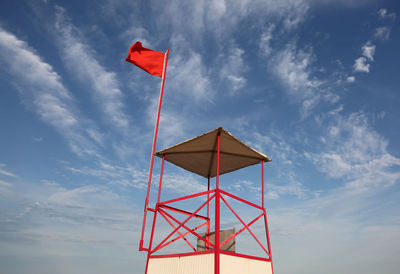 Low angle view of flag tower against sky