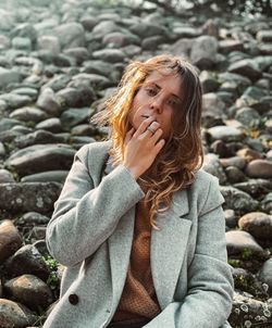 Portrait of woman on rock