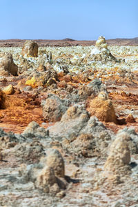 Rock formation on land against sky