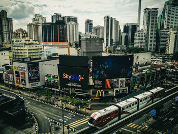 High angle view of street amidst buildings in city