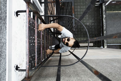 Directly above shot of man climbing ladder