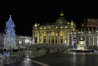 Illuminated buildings in city at night