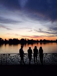 Friends in lake at sunset