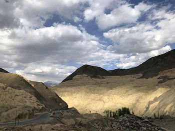 Scenic view of landscape and mountains against sky