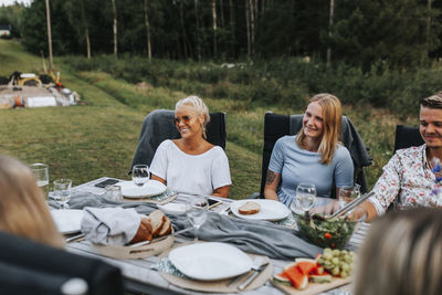 Group of people sitting on table