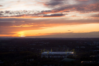 High angle view of buildings against sky during sunset