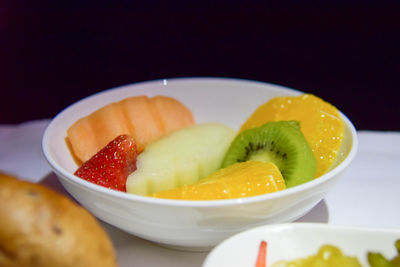 Close-up of fruits in bowl on table