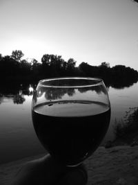 Close-up of wineglass against clear sky