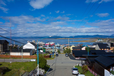 High angle view of street amidst buildings against sky